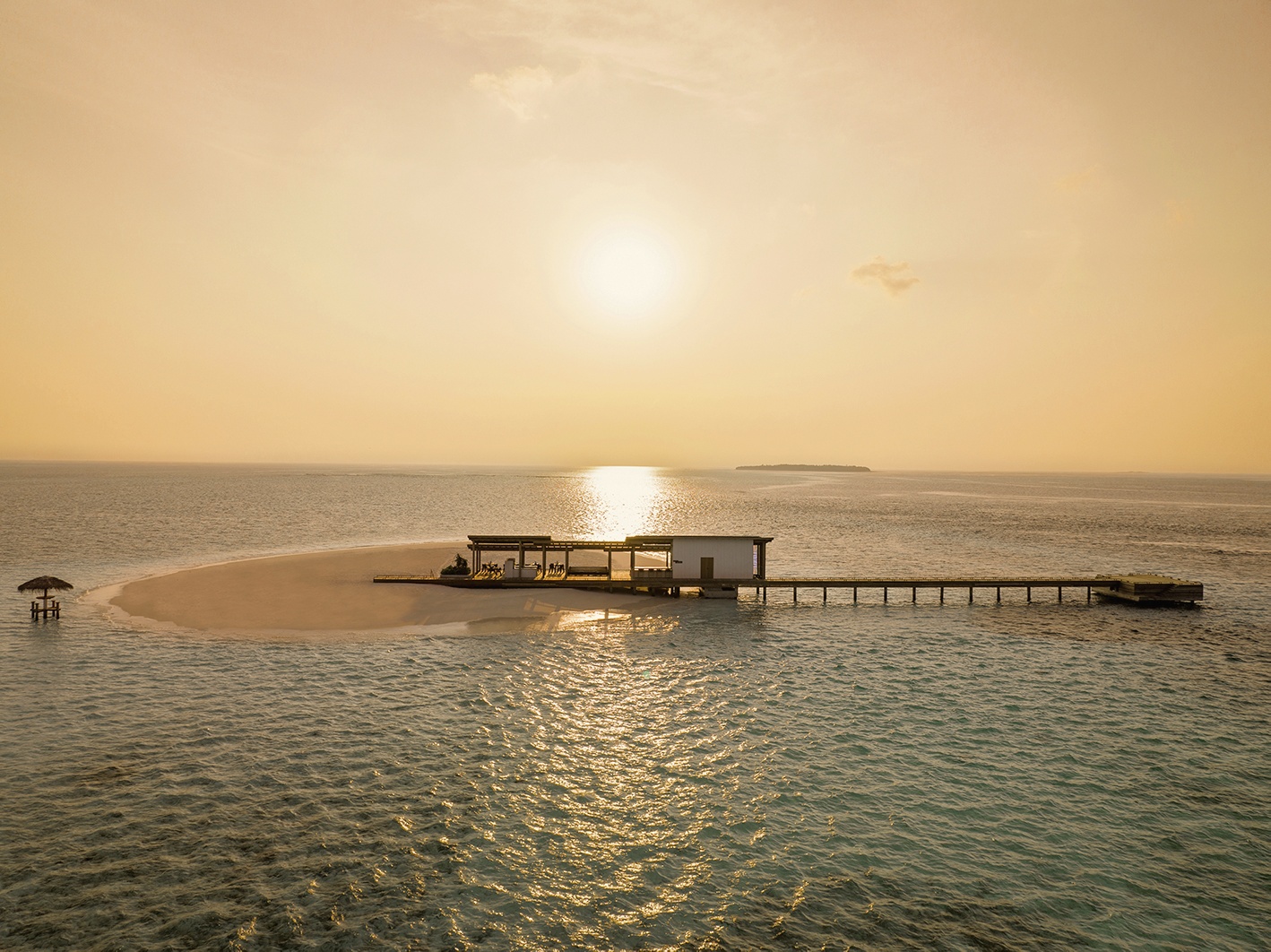 The Shack at the water's edge. Dining at Alila Kothaifaru is open-air and positioned to face the lagoon.