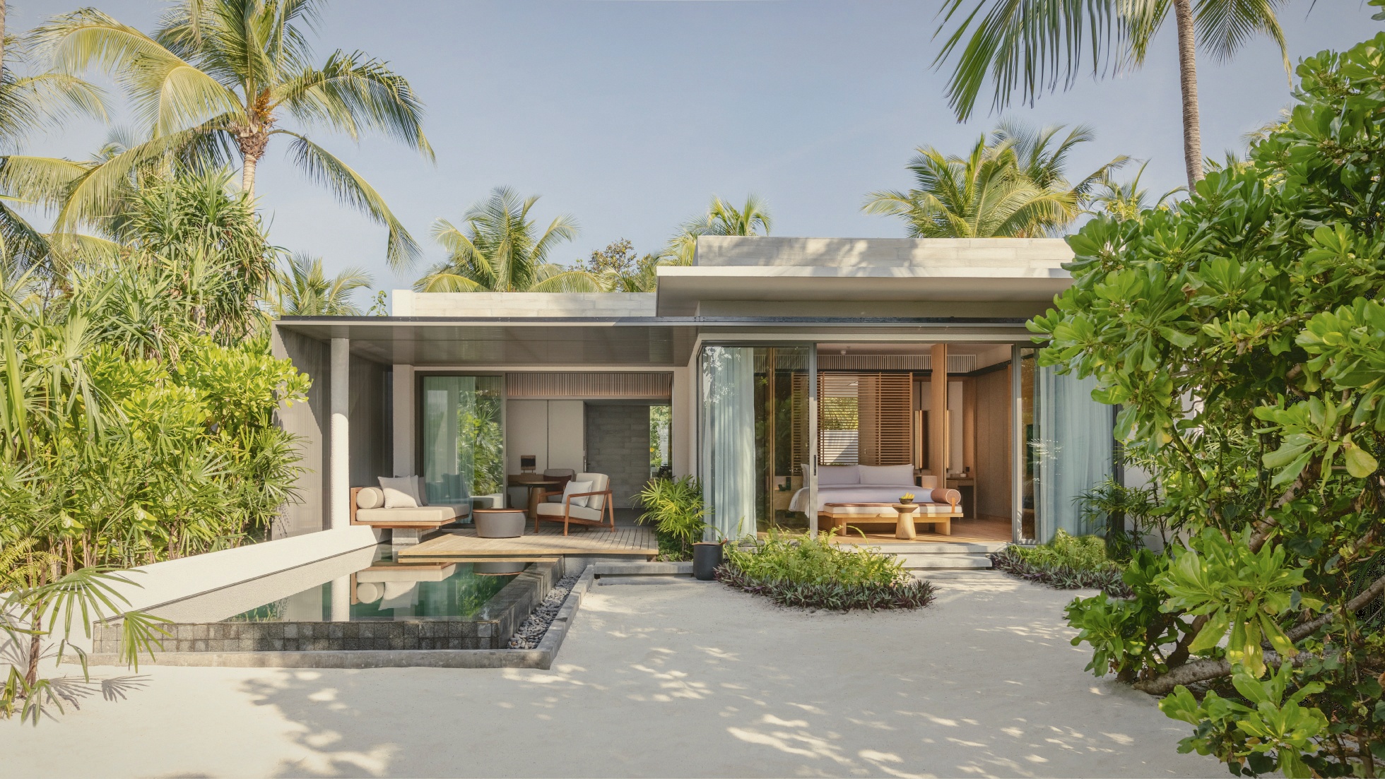 The interior of a beach pool villa. Alila's minimalist finish: pale timber, clean lines, no decorative excess.