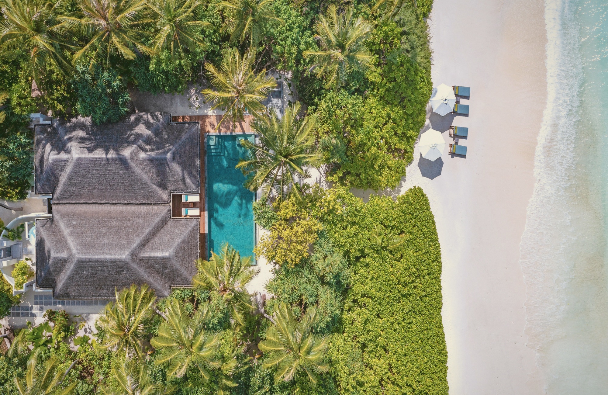 Beach pool villa. Direct sand access on the productive Kihavah shoreline.