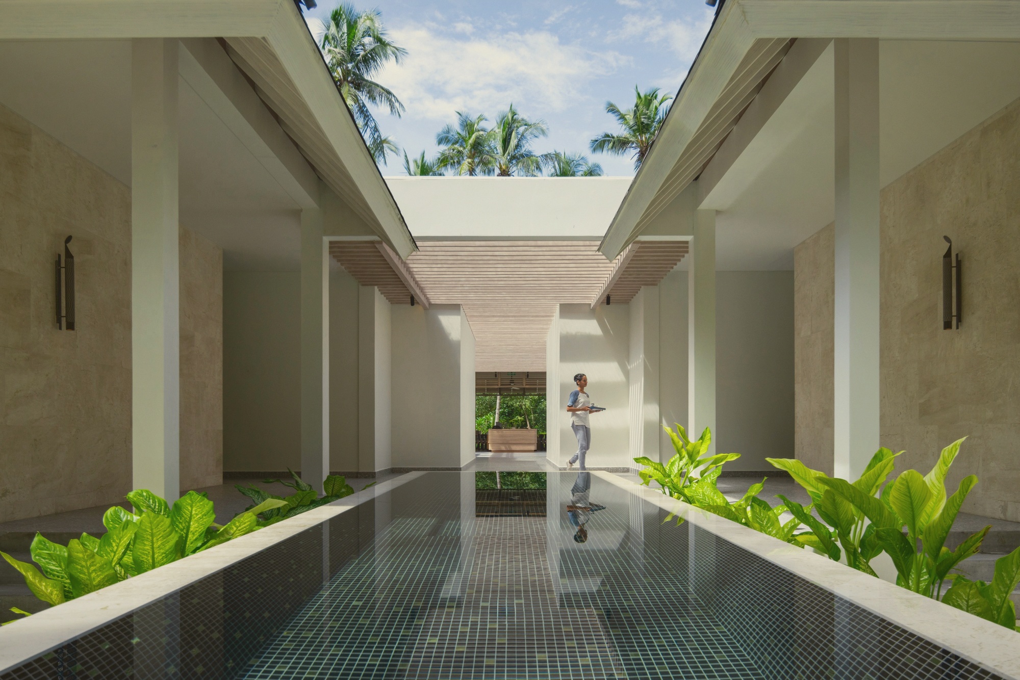 The pool or wellness space at ground level. Baa Atoll's calm conditions make outdoor treatment and pool use practical for most of the year.