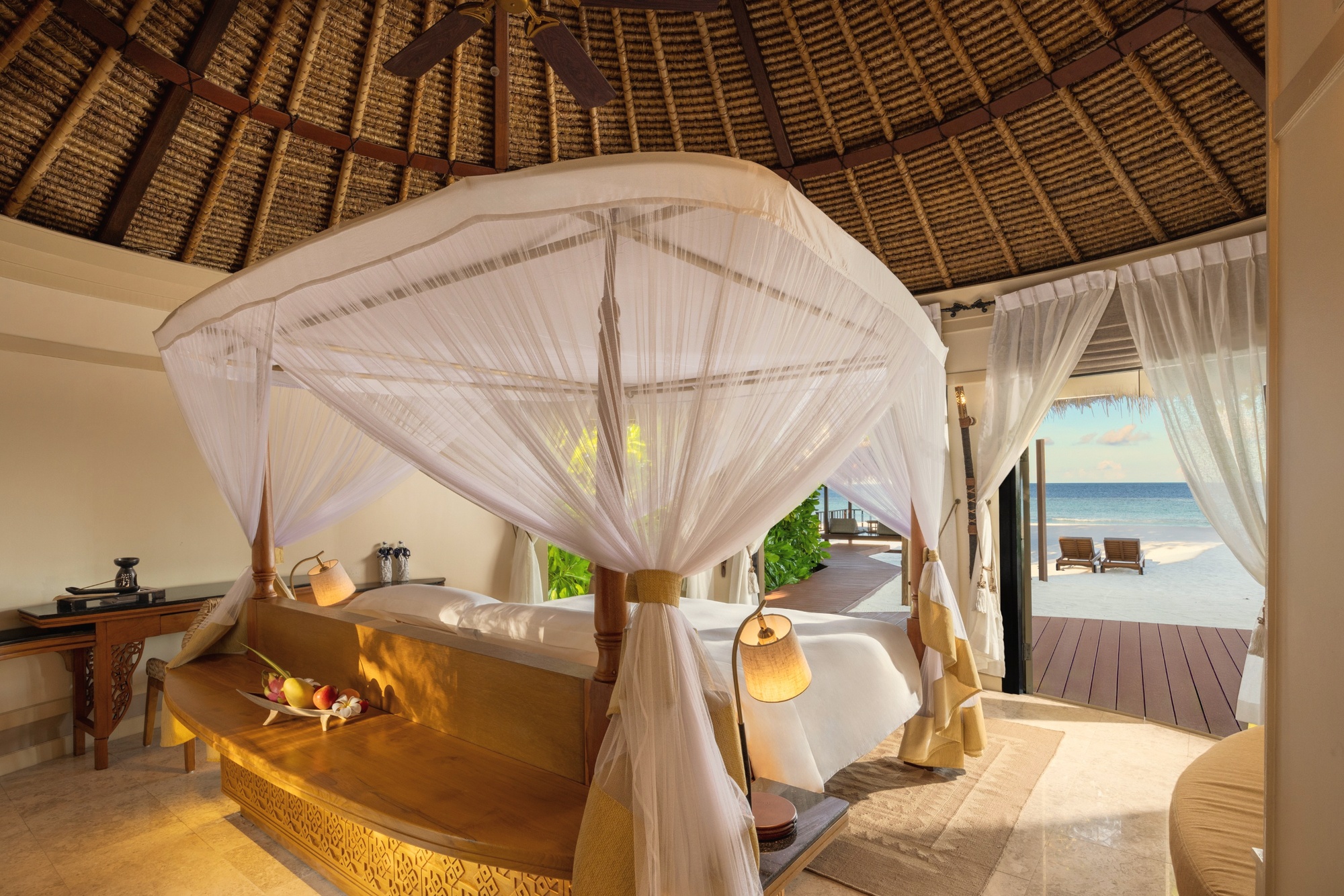 A beach pool villa from the garden side. Each villa has its own private pool set within a walled garden, with direct beach access beyond.