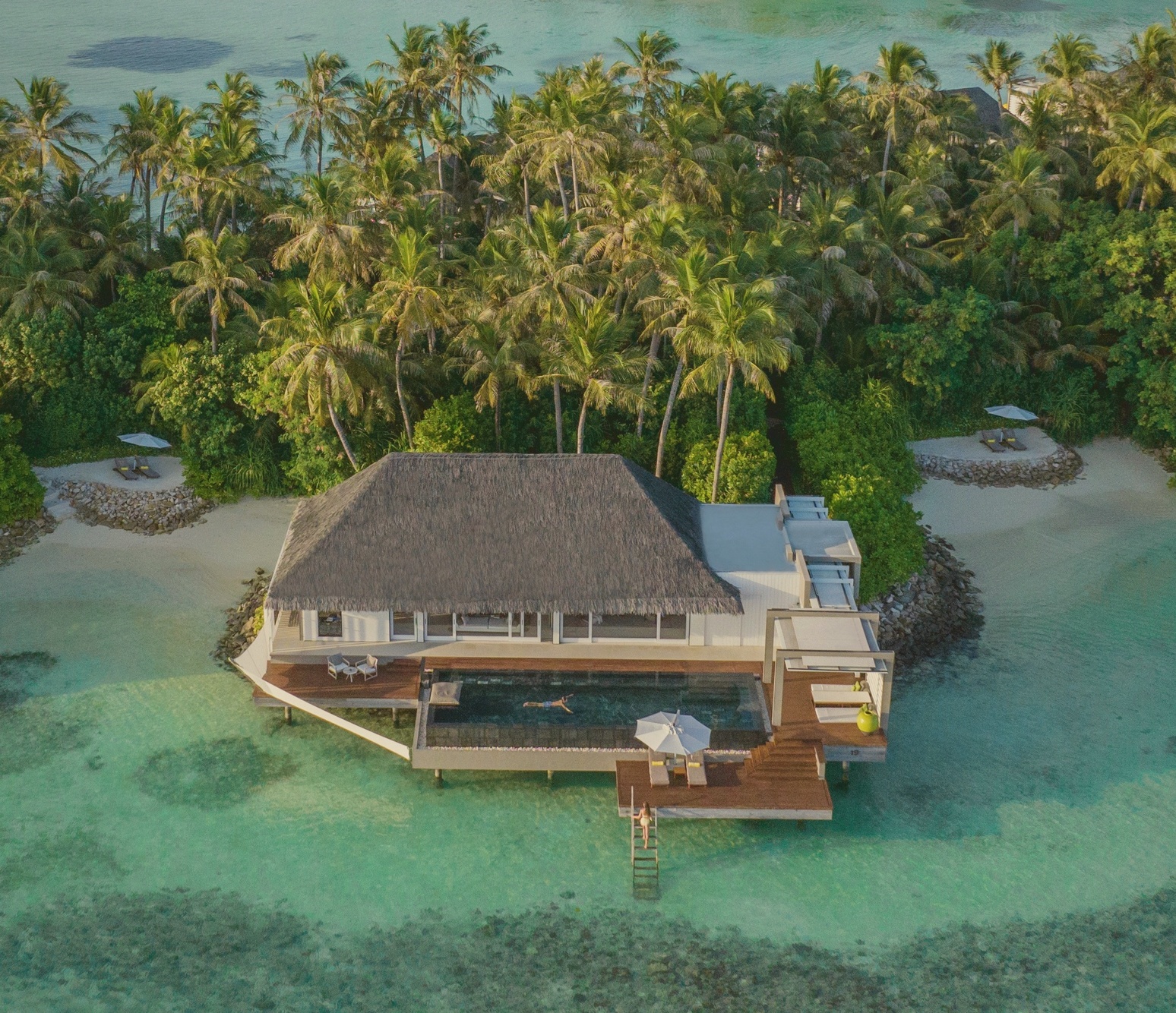 Garden villa deck. The lagoon-side configuration that sits below the headline overwater categories without compromising the Cheval Blanc finishes.