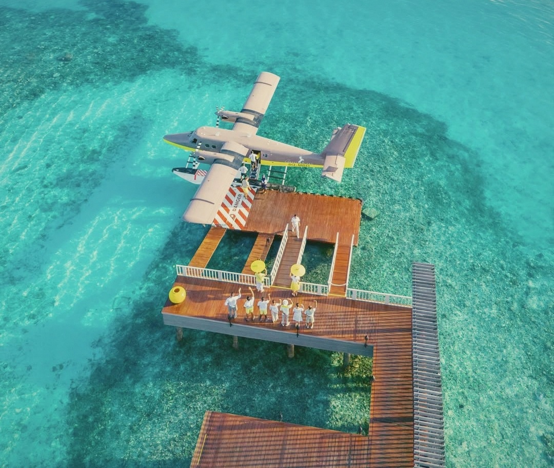 Capitaine arrival point. The one-Capitaine-per-villa model is operational from the moment guests step off the seaplane.