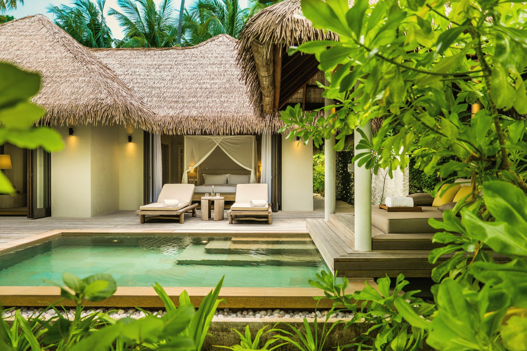 Beach villa pool. COMO's design language applied to the residential spaces, characteristically restrained.