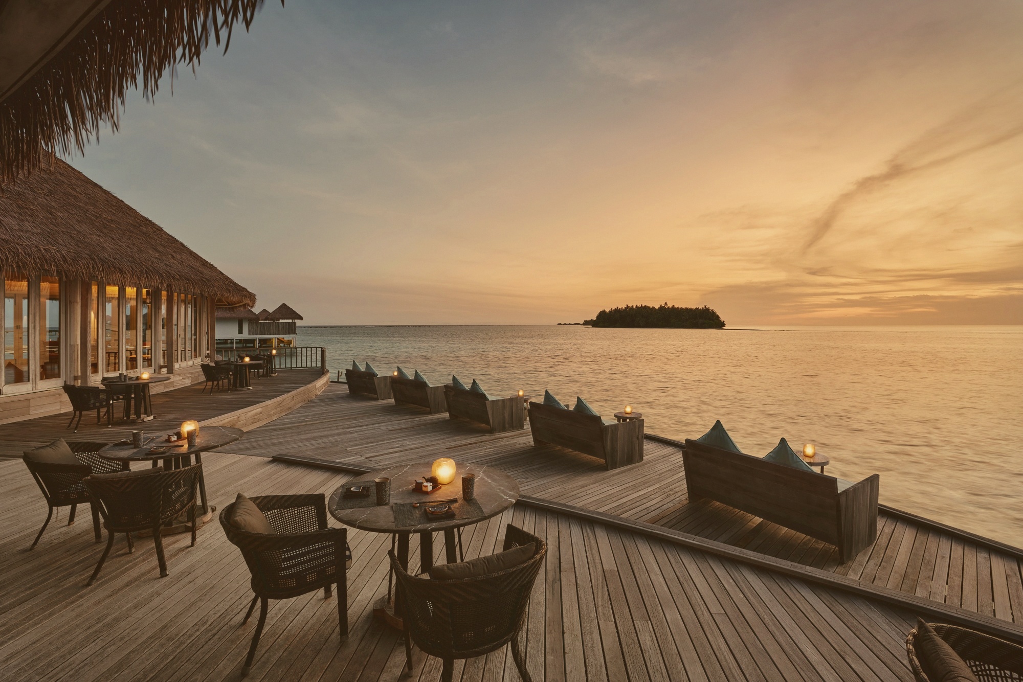 Sunset jetty. Maalifushi's main evening gathering point, west-facing across the productive Thaa Atoll lagoon.