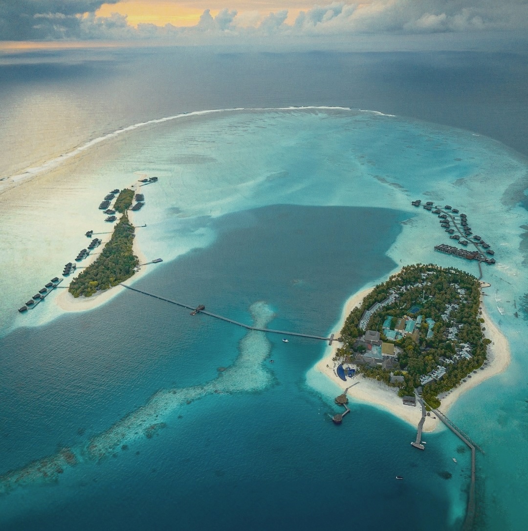 The bridge between Rangali and Rangali Finolhu. The two-island layout that gives Conrad its dual-character proposition.
