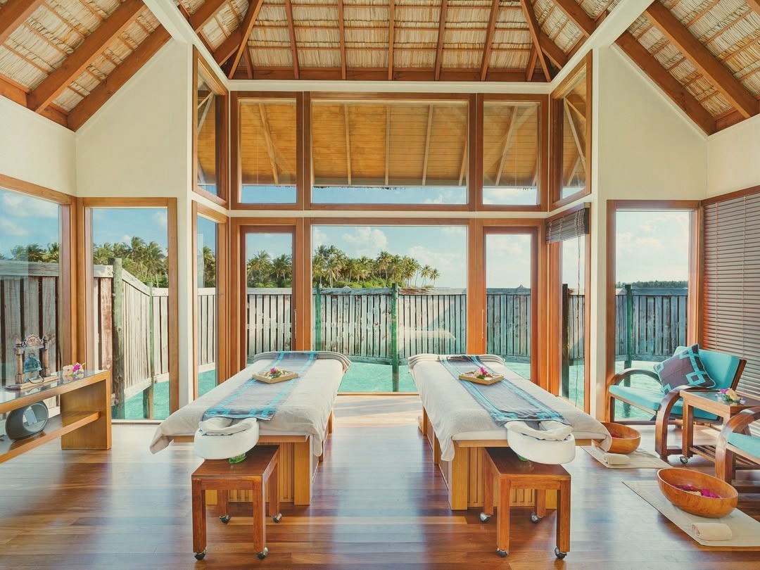 The over-water spa. The longest-operating overwater spa in the Maldives, glass-floored treatment rooms throughout.