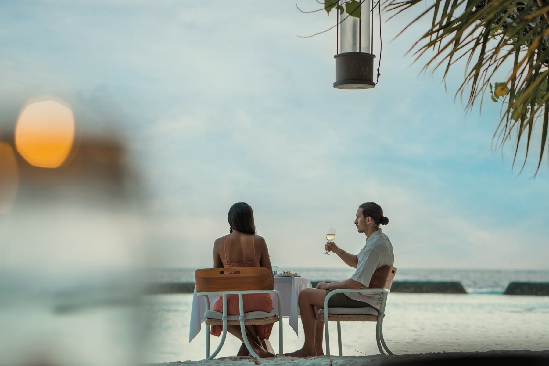 Dining at the water's edge. The all-inclusive programme covers meals and drinks across the property, without a running tab.