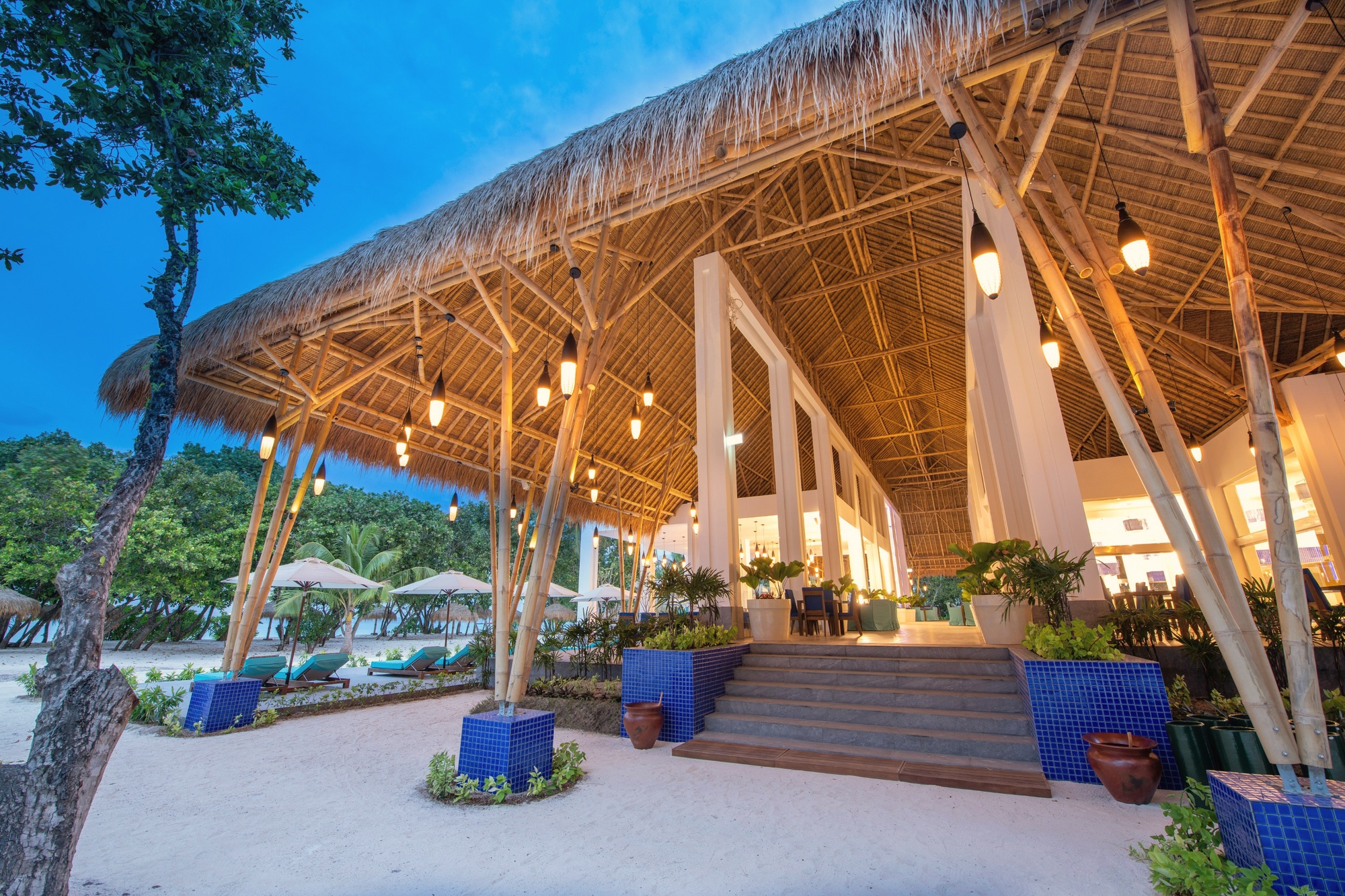 The main restaurant at dinner service. The all-inclusive dining programme runs across multiple venues on the island.