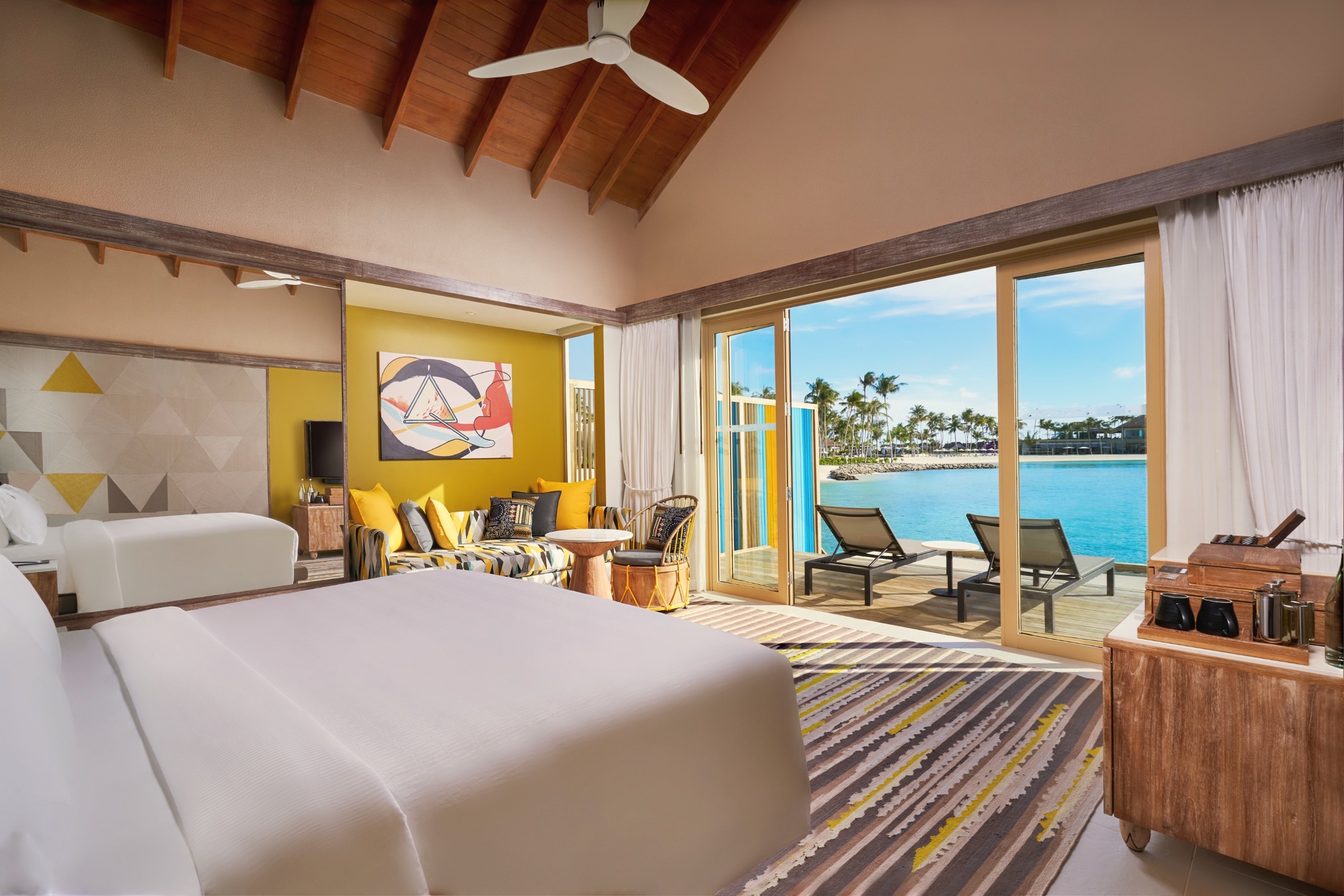 A pool villa interior. The Hard Rock memorabilia programme runs through the rooms, giving the property a distinct identity from the standard Maldives resort.