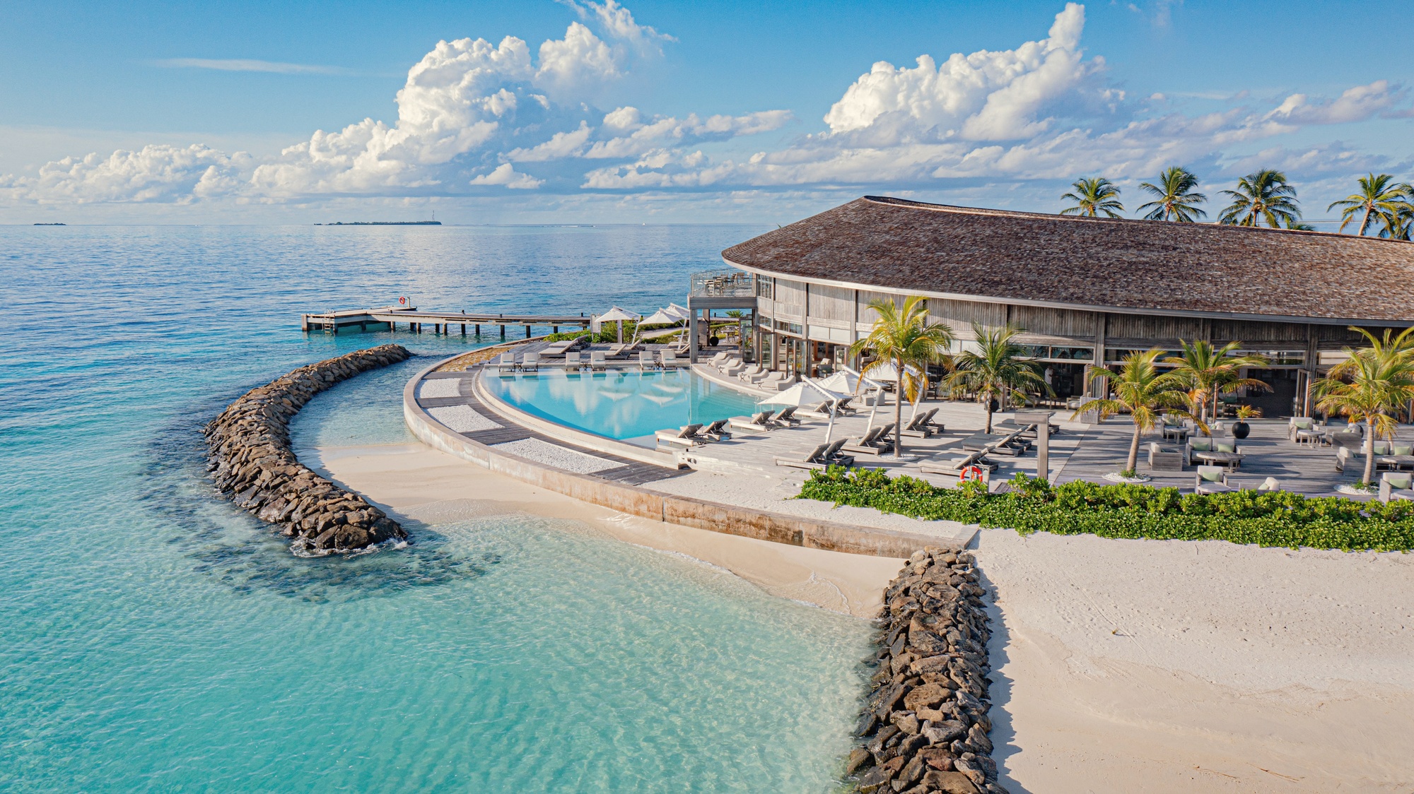 Kagi from above. The smaller-island wellness property, North Malé positioning with thirty-minute speedboat transfer.