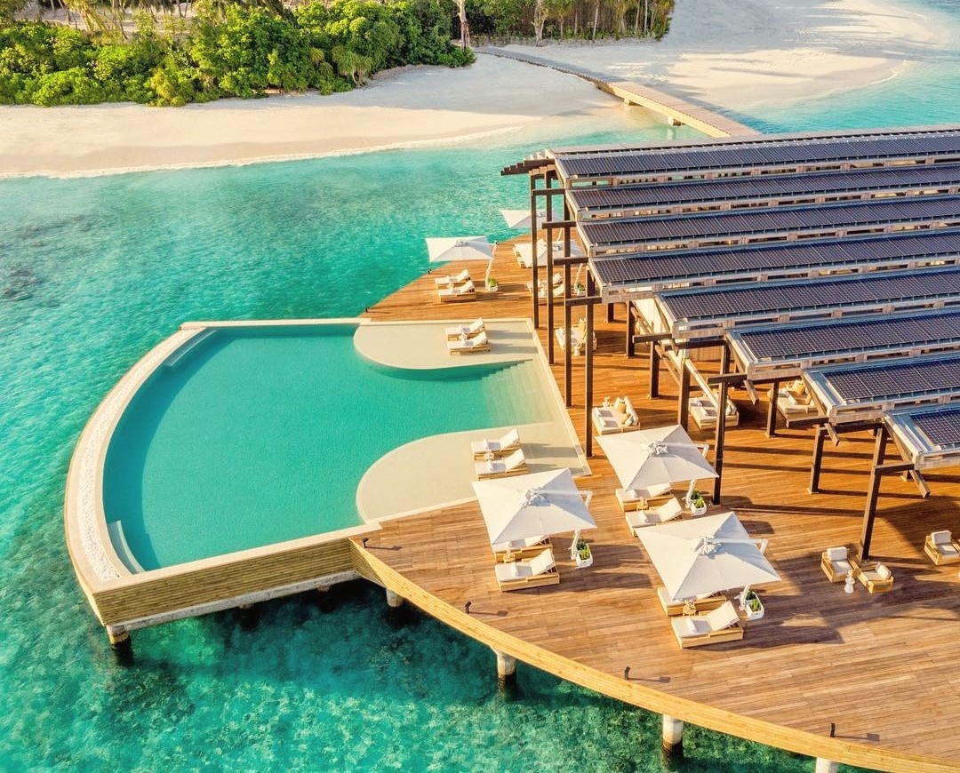 Sunset deck. The property's main evening gathering point, west-facing across the lagoon.