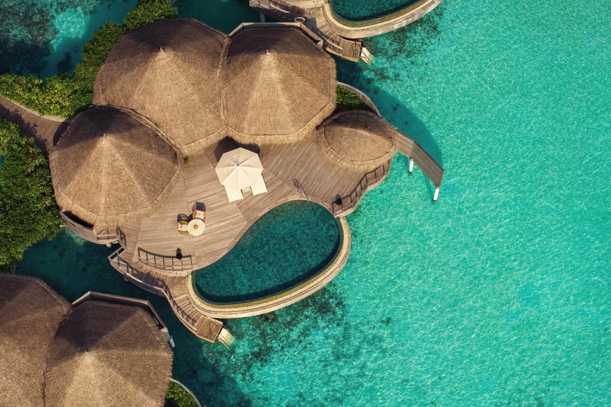 A villa exterior at the water's edge. Every villa at The Nautilus includes a private pool, with direct access to the lagoon or beach depending on category.