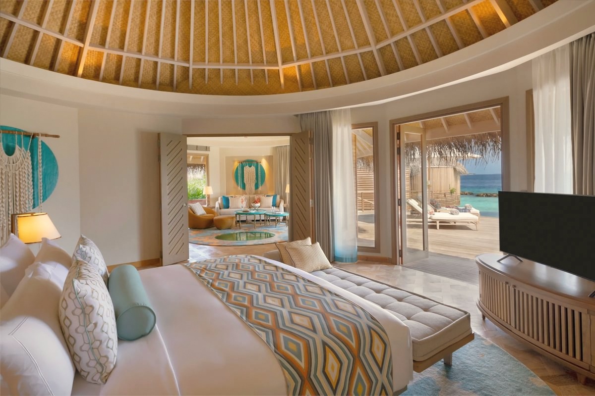 The interior of a residence-category villa. One to three bedrooms, generous proportions, and a private pool deck that functions as an outdoor room.