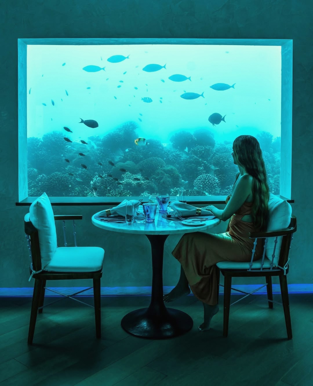 Dining at the water's edge. The restaurant opens toward the lagoon, and the tables closest to the rail are the ones to request.