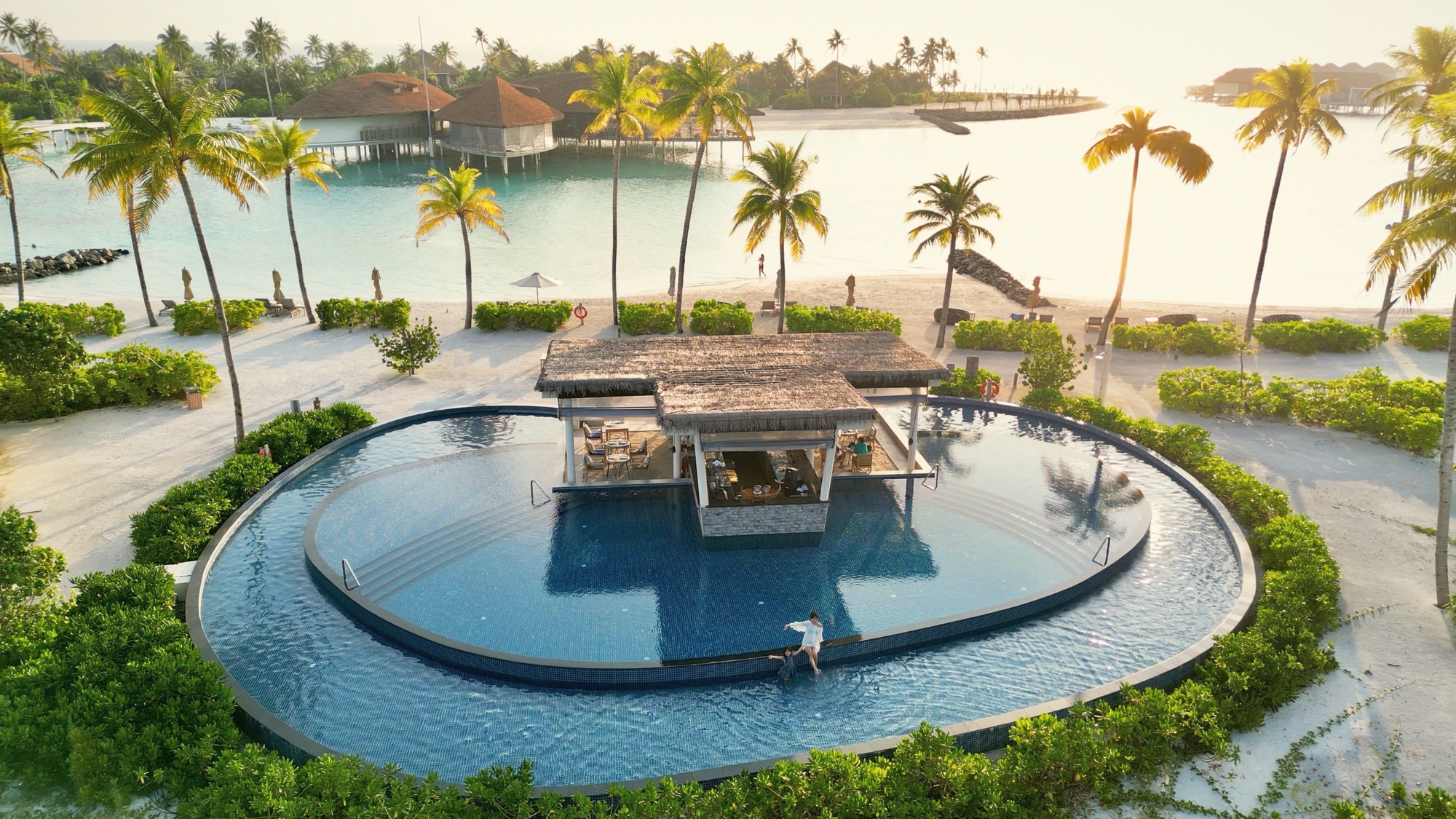 The pool and spa area. A 5-star resort standard applied to a small island, with the lagoon visible from the treatment rooms.