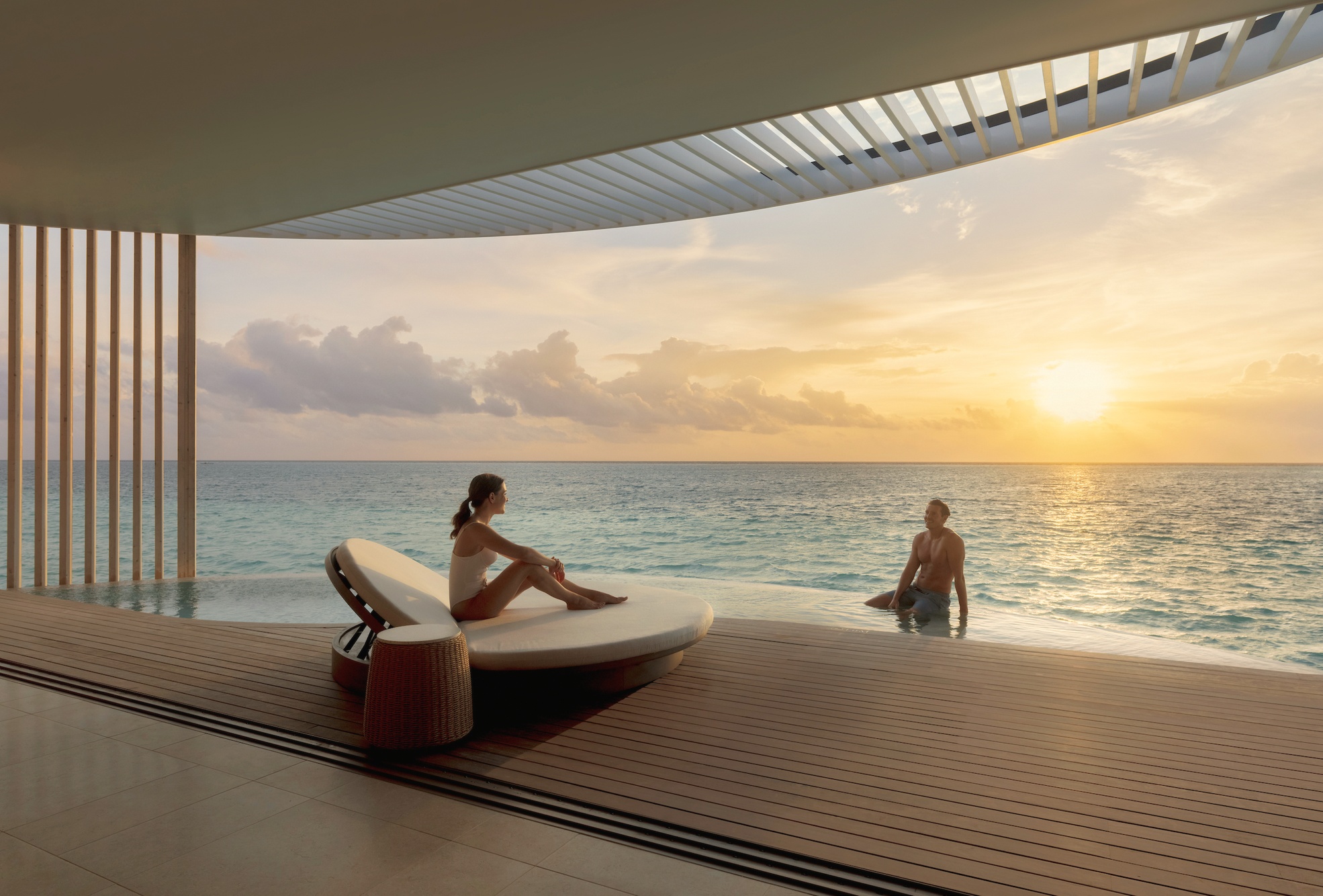 Inside a Lagoon Pool Villa. Floor-to-ceiling glass, a private pool deck, and direct lagoon access from the villa.