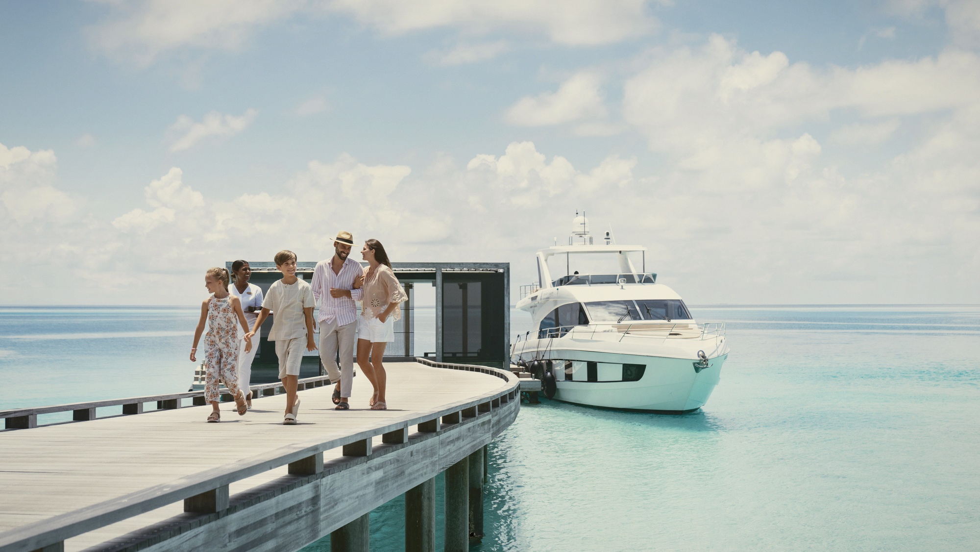 Speedboat arrival at the jetty. Forty-five minutes from Velana International Airport, no seaplane logistics, no soft-bag restriction.