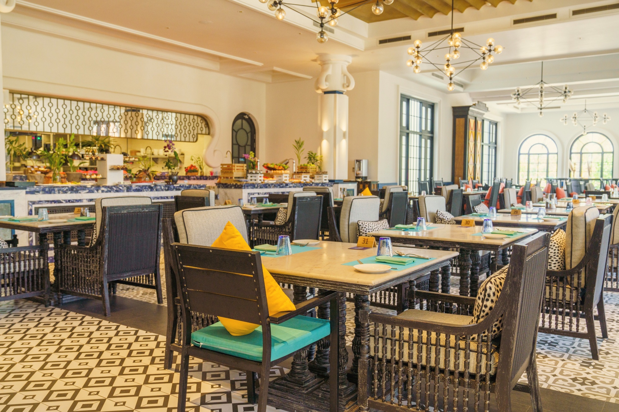 The Sunset Pool Café at SAii Lagoon. The resort's headline dining anchor, positioned at the water's edge with views across the lagoon.
