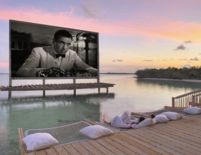 Cinema Paradiso at Soneva Jani. The open-air cinema reproduced on the sister property, screening across the stay schedule.