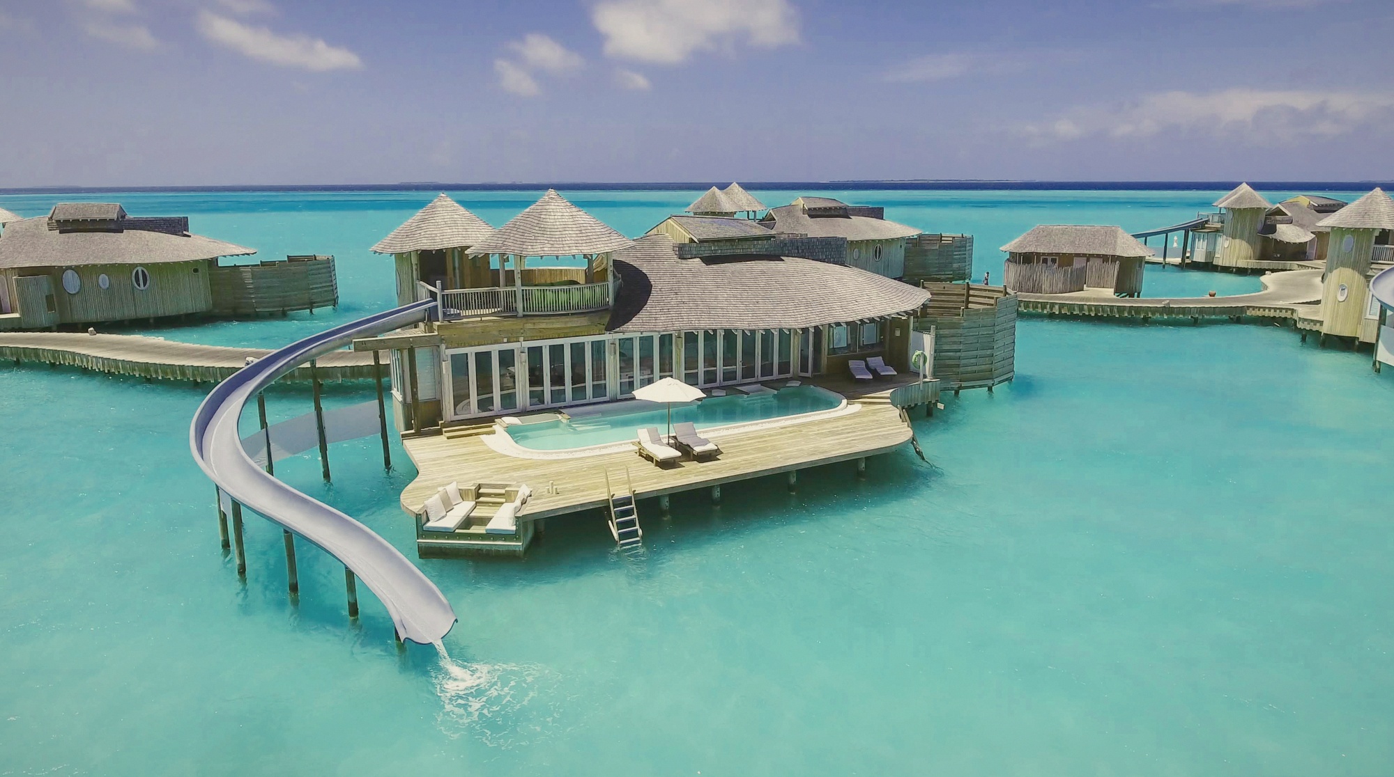 The water reserve slide. A Soneva Jani signature, direct from villa deck into the lagoon below.