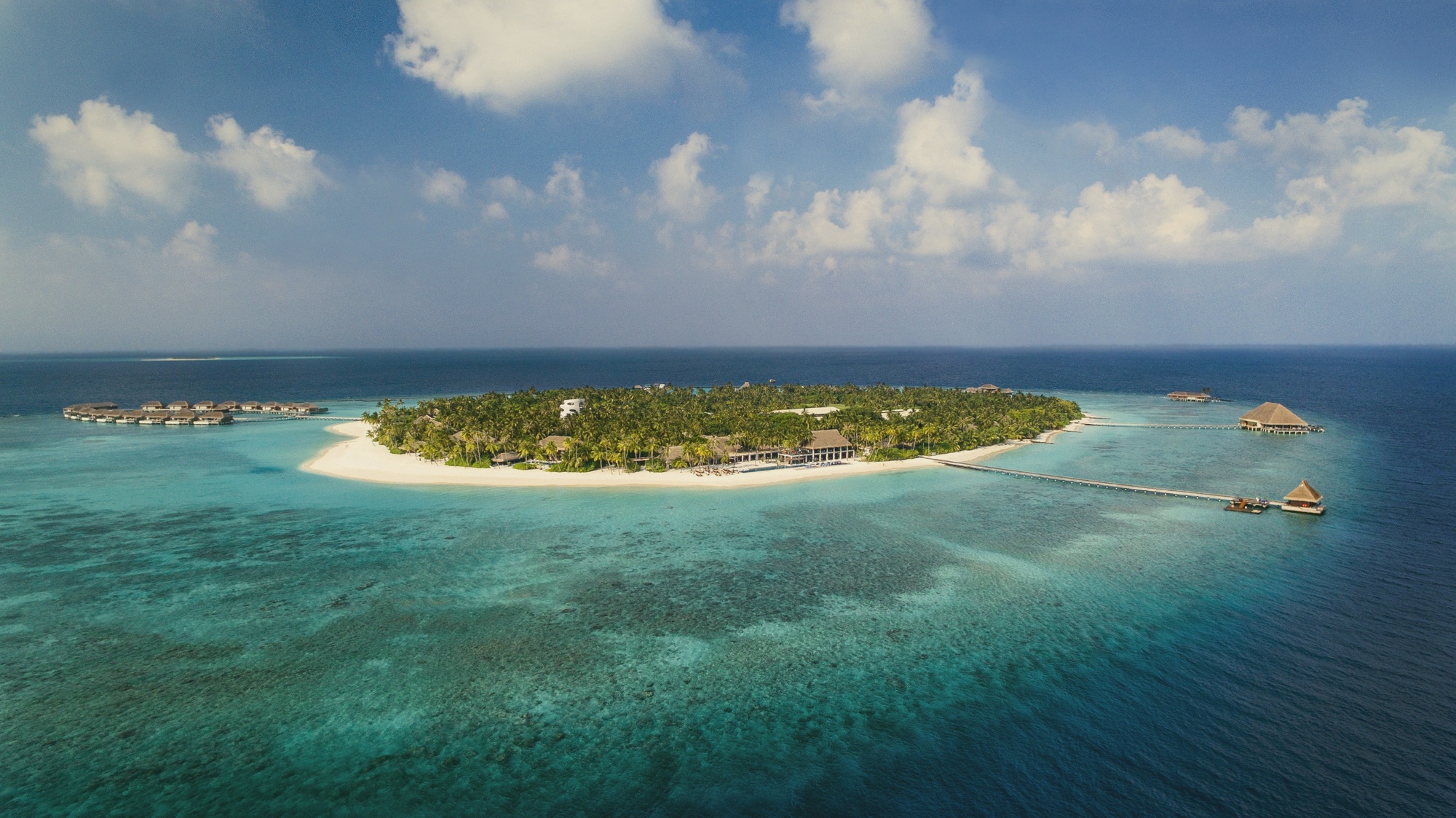 Velaa from above. The velaa-shaped island layout (Maldivian for 'turtle') gives the resort its name and its iconic aerial profile.