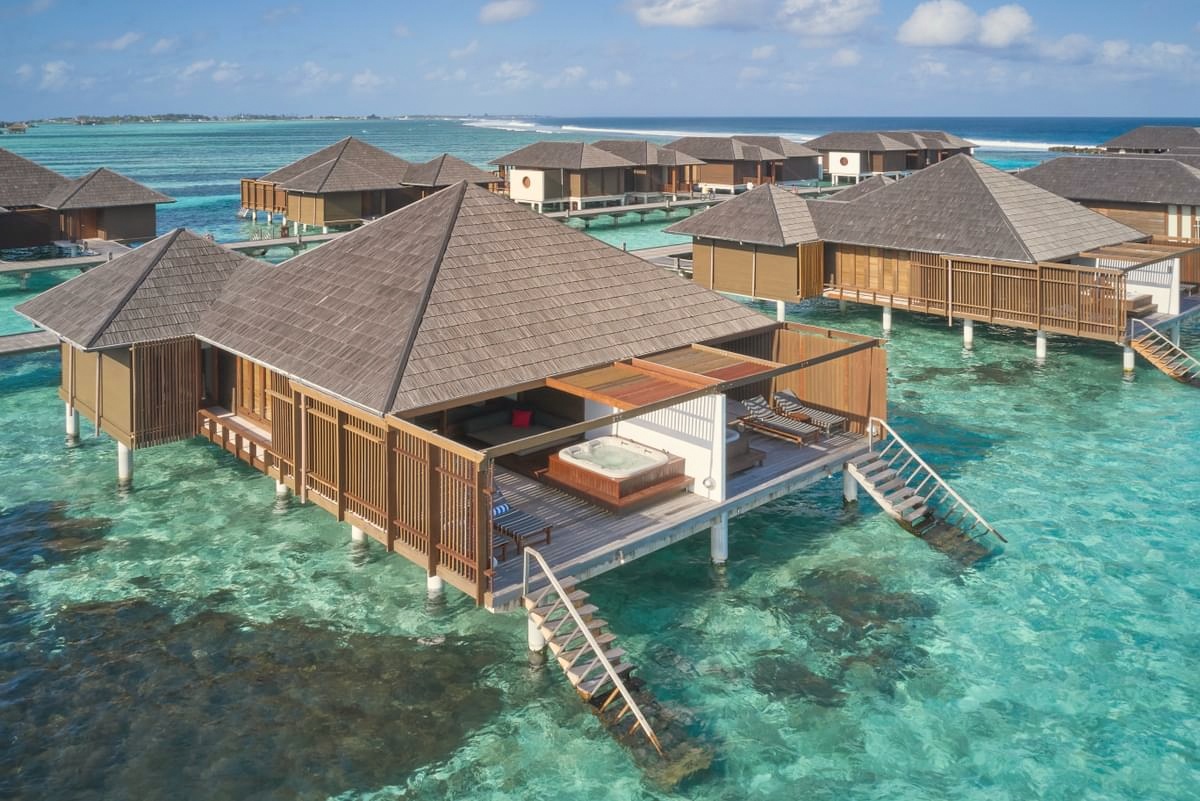 A Water Villa from the deck. The overwater villas extend directly above the lagoon, with steps down to the water from the private terrace.